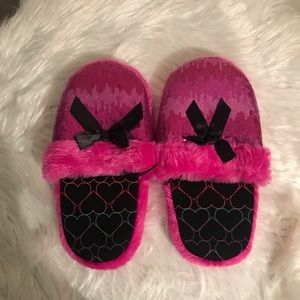 Pink and black slippers
